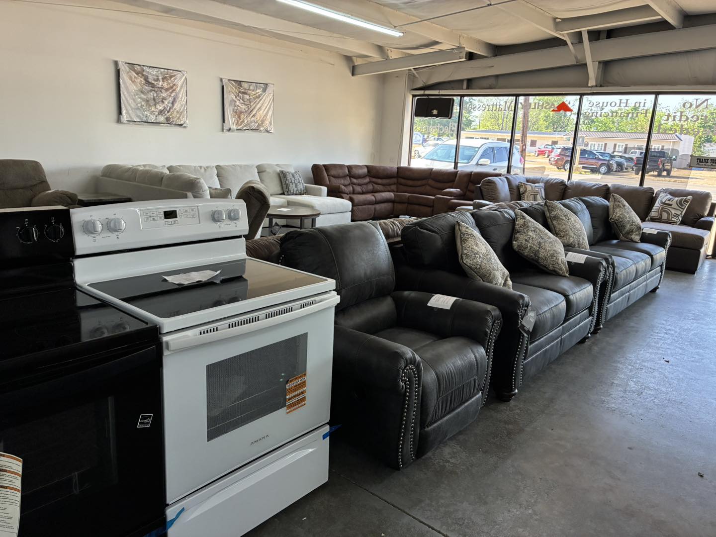 Holder's Home Center showroom with sofas, recliners, and appliances